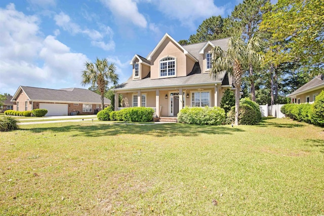 cape cod house with a garage, covered porch, and a front yard