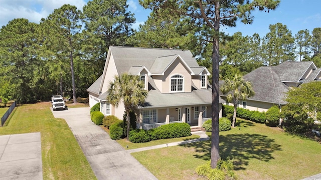 view of front of house featuring a front yard and a porch