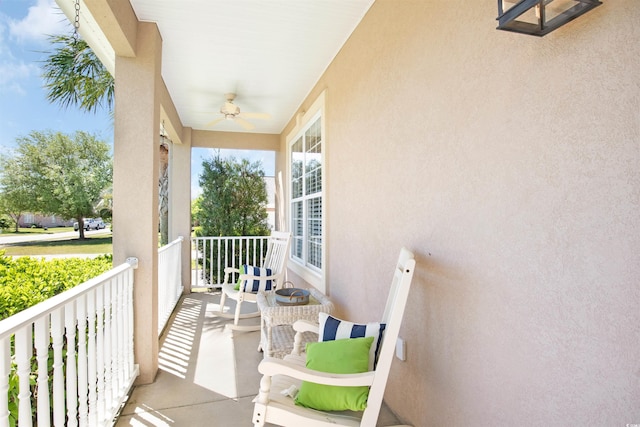 balcony with ceiling fan and covered porch