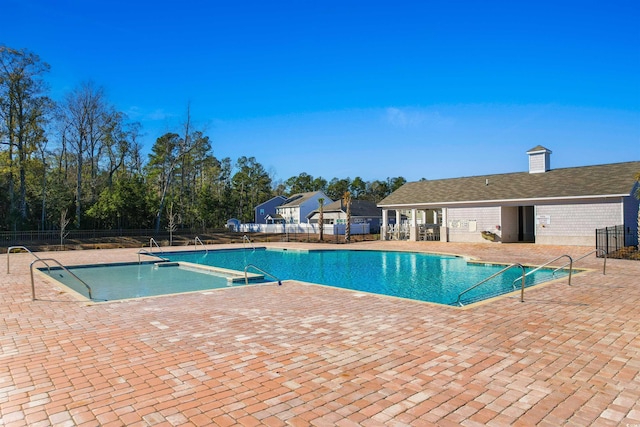 view of swimming pool with a patio area