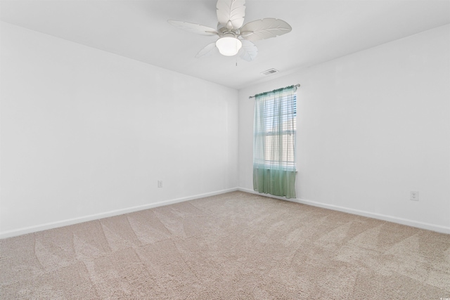 carpeted empty room with ceiling fan