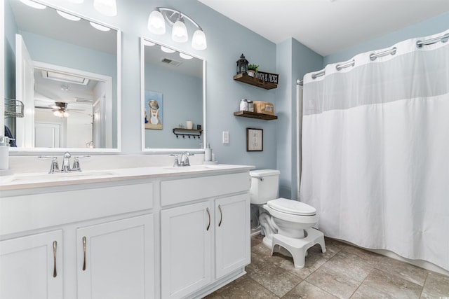 bathroom featuring ceiling fan, toilet, walk in shower, and vanity