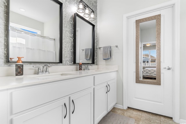 bathroom featuring vanity and ceiling fan