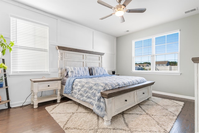 bedroom with ceiling fan and dark hardwood / wood-style flooring