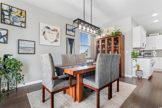 dining area featuring dark hardwood / wood-style flooring