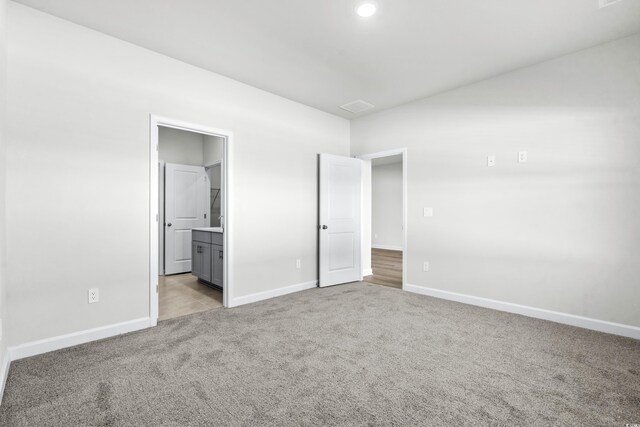 2039 Copper Creek Loop, Longs, SC 29568 - unfurnished bedroom with light colored carpet and ensuite bath
