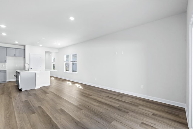 2039 Copper Creek Loop, Longs, SC 29568 - unfurnished living room featuring sink and wood-type flooring