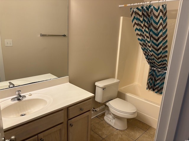 full bathroom featuring tile patterned floors, shower / bath combo with shower curtain, vanity, and toilet