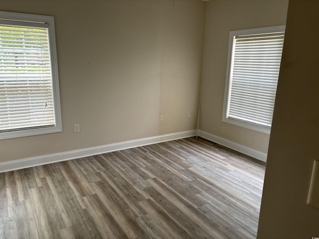 spare room featuring hardwood / wood-style floors