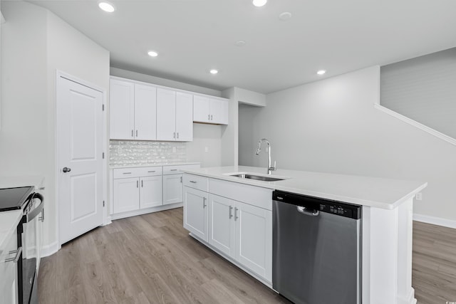 kitchen featuring white cabinetry, an island with sink, sink, stainless steel dishwasher, and black electric range