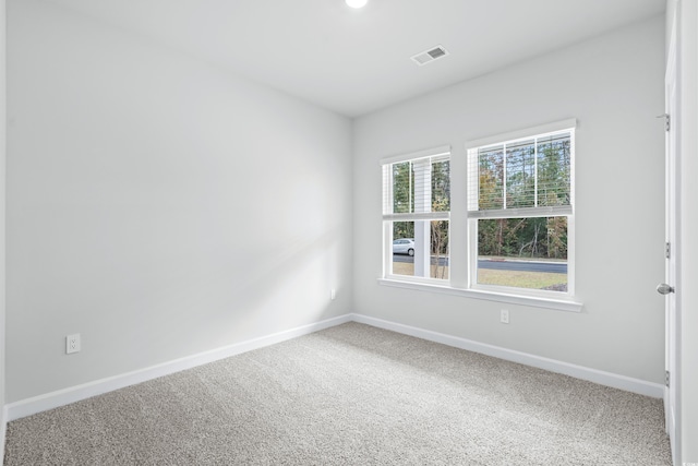 empty room with carpet flooring