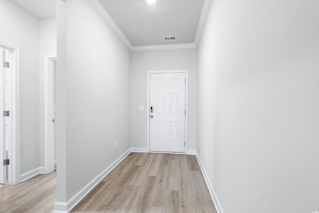 corridor featuring light hardwood / wood-style flooring and ornamental molding