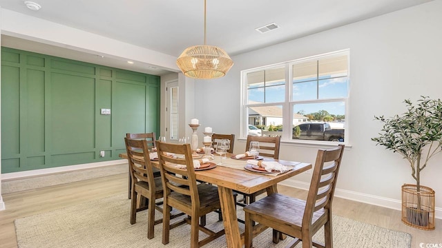 dining space featuring light hardwood / wood-style flooring