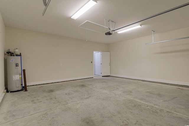 garage featuring electric water heater and a garage door opener