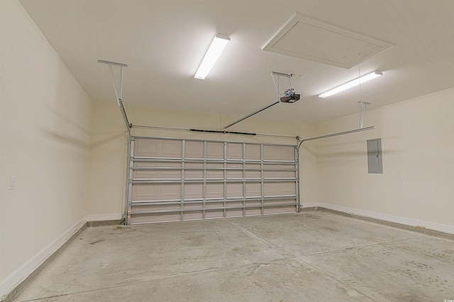 garage featuring a garage door opener and electric panel