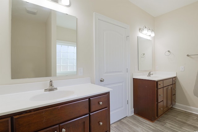 bathroom featuring hardwood / wood-style floors and vanity