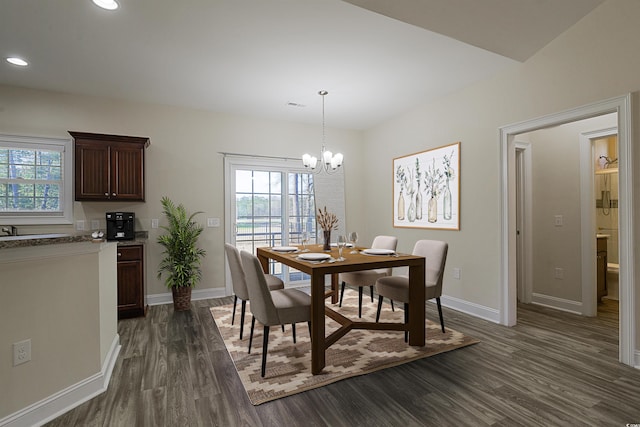 dining room featuring dark wood-type flooring and a notable chandelier