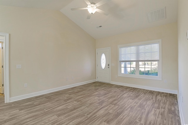 entrance foyer with ceiling fan, light hardwood / wood-style floors, and vaulted ceiling