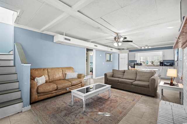 living room with ceiling fan, beamed ceiling, and light tile patterned floors