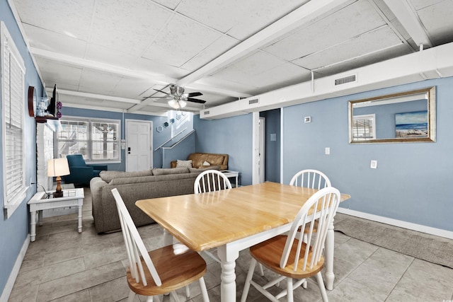 tiled dining room featuring ceiling fan