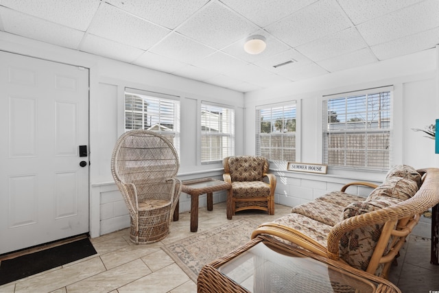 sunroom / solarium with a drop ceiling