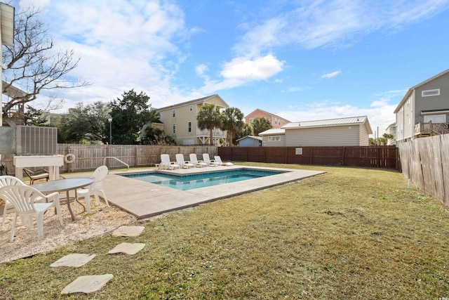 view of swimming pool with a patio area and a yard