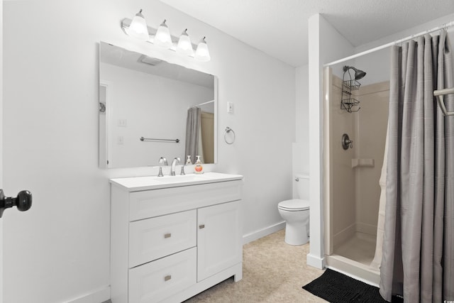 bathroom with a shower with curtain, vanity, a textured ceiling, and toilet