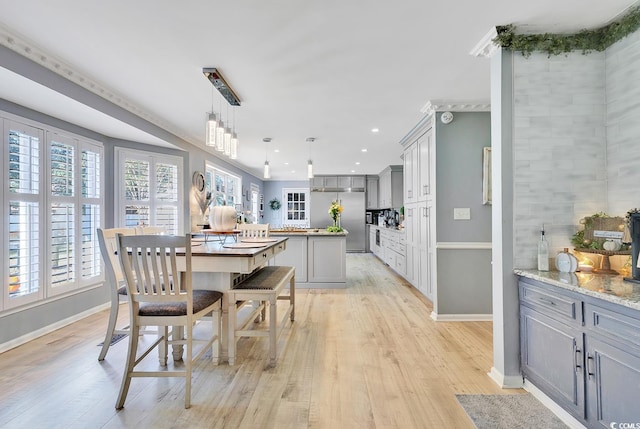 dining area featuring light wood-type flooring