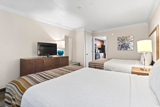 bedroom featuring a textured ceiling, black fridge, and crown molding