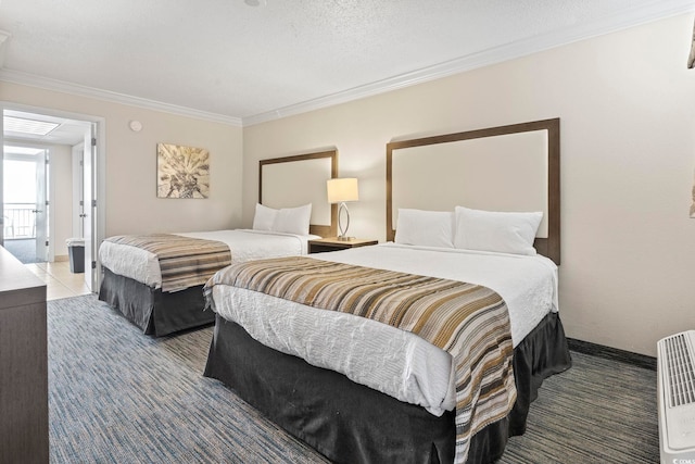 bedroom featuring a textured ceiling and ornamental molding