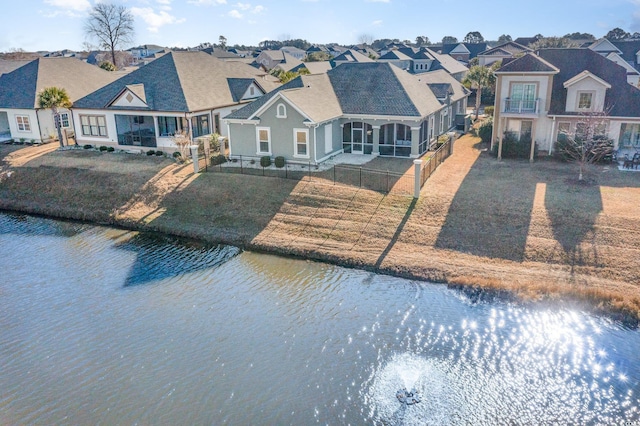 exterior space featuring a front yard and a water view