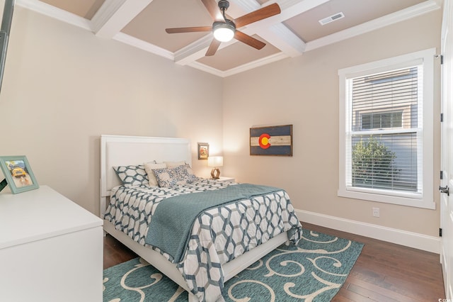 bedroom with ceiling fan, beam ceiling, crown molding, and coffered ceiling