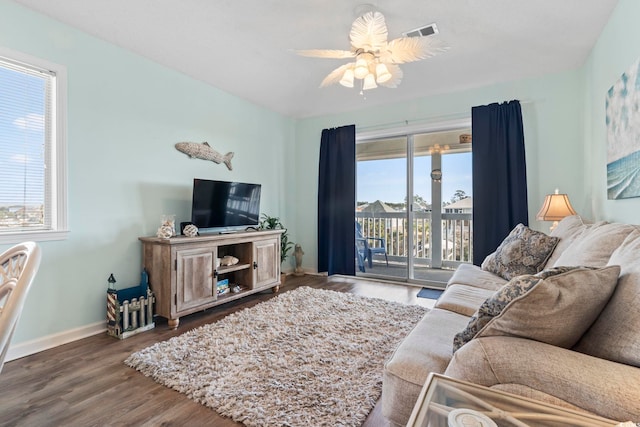 living room with hardwood / wood-style flooring, plenty of natural light, and ceiling fan