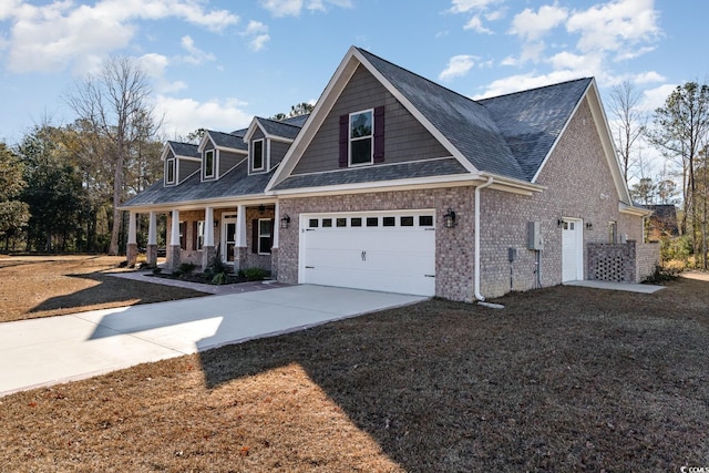 view of front of house featuring covered porch and a garage