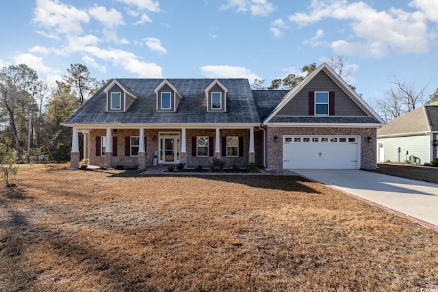 view of front of house with covered porch and a garage