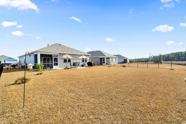 rear view of property with a sunroom