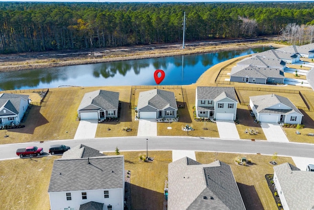 birds eye view of property featuring a water view