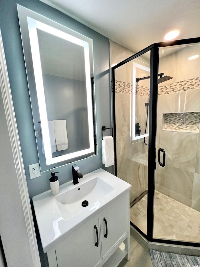 bathroom featuring vanity and walk in shower