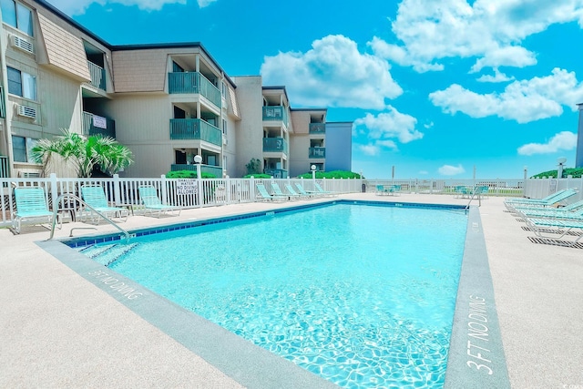 view of swimming pool featuring a patio