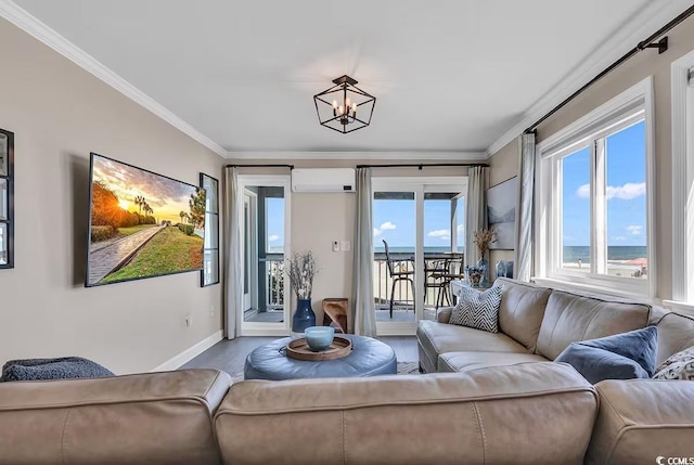 living room featuring a water view, ornamental molding, a wall unit AC, and an inviting chandelier