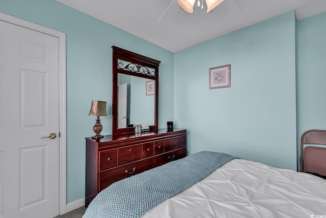 bedroom with ceiling fan and carpet