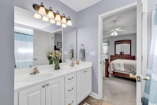 bathroom with ceiling fan and vanity