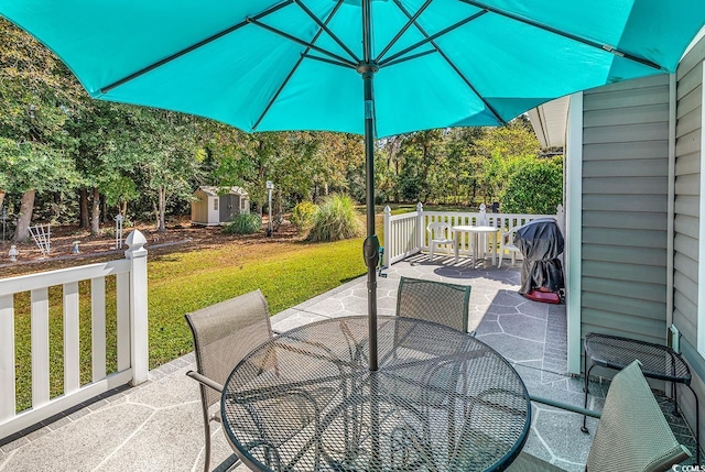 view of patio / terrace with a shed