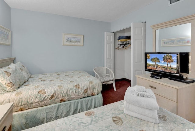 carpeted bedroom featuring a closet