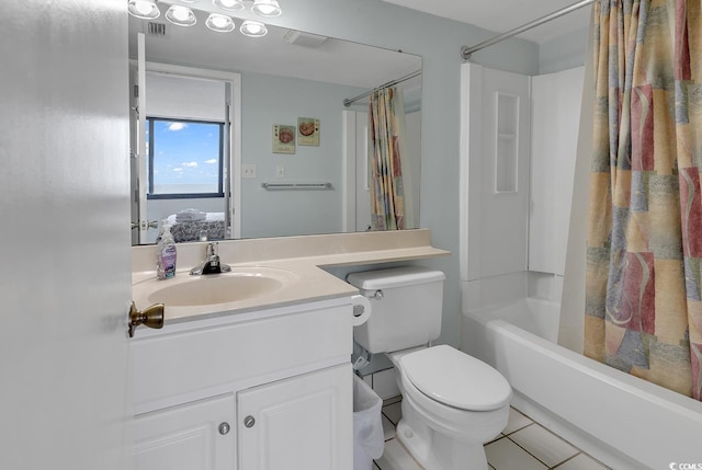 full bathroom featuring tile patterned flooring, vanity, shower / bath combination with curtain, and toilet