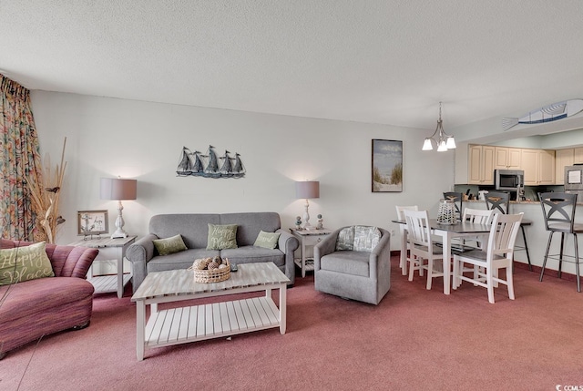 living room with carpet floors, a chandelier, and a textured ceiling