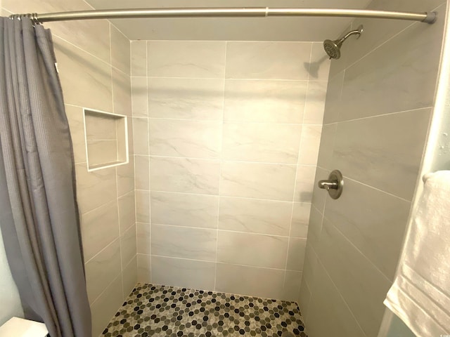 bathroom with curtained shower