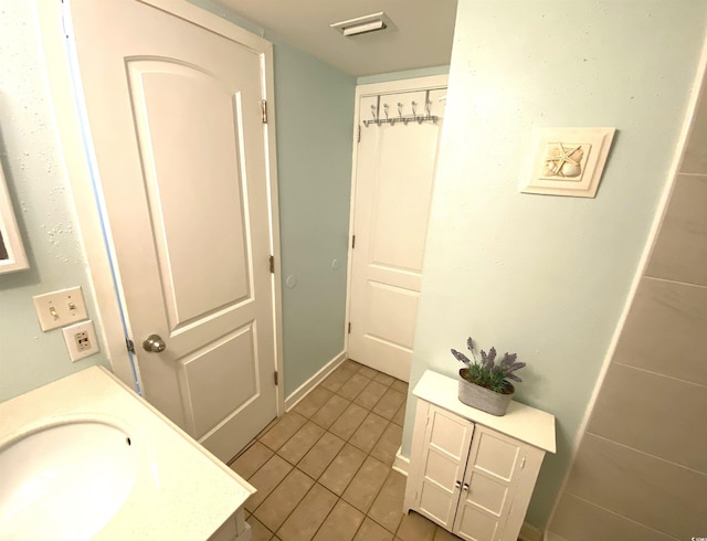 bathroom featuring tile patterned floors and sink