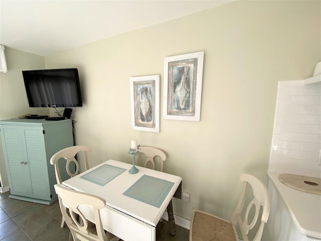 dining space with tile patterned floors