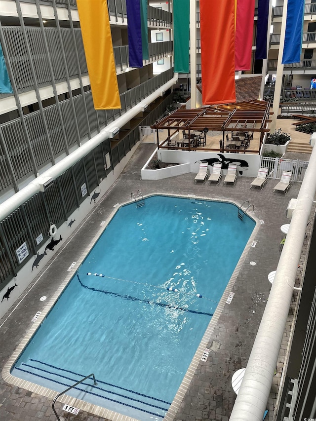 view of swimming pool featuring a patio